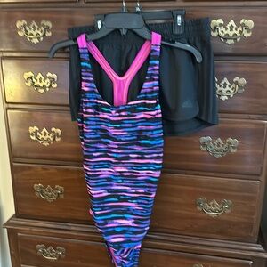 Women’s Speedo swim suit sz 12. Matching shorts, Adidas brand sz Medium.